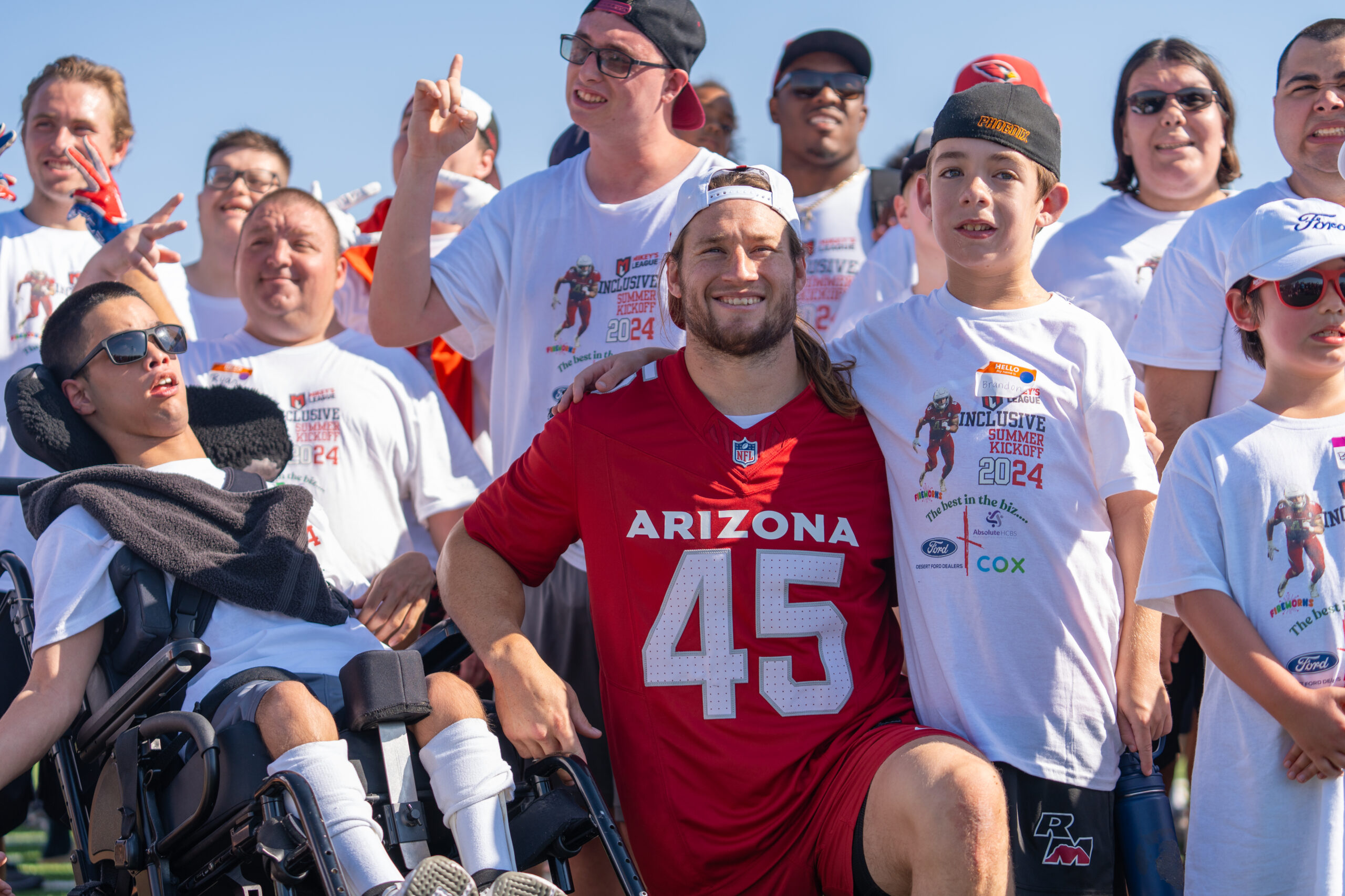 Athletes at Mikey's League event with Arizona Cardinals player